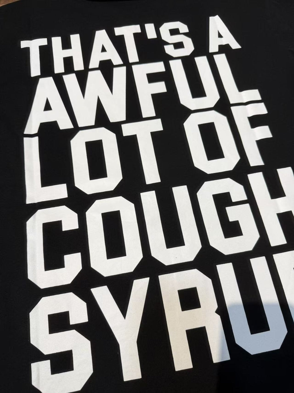 THAT'S A AWFUL LOT OF COUGH SYRUP White & Blue Graphic T-Shirt ¡ª detail