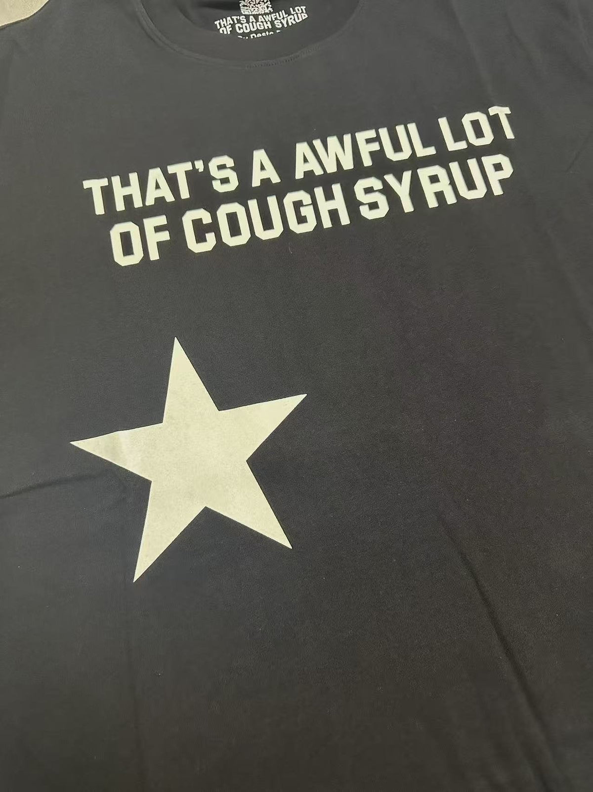 THAT'S A AWFUL LOT OF COUGH SYRUP Star Graphic Short-Sleeve T-Shirt ¡ª detail
