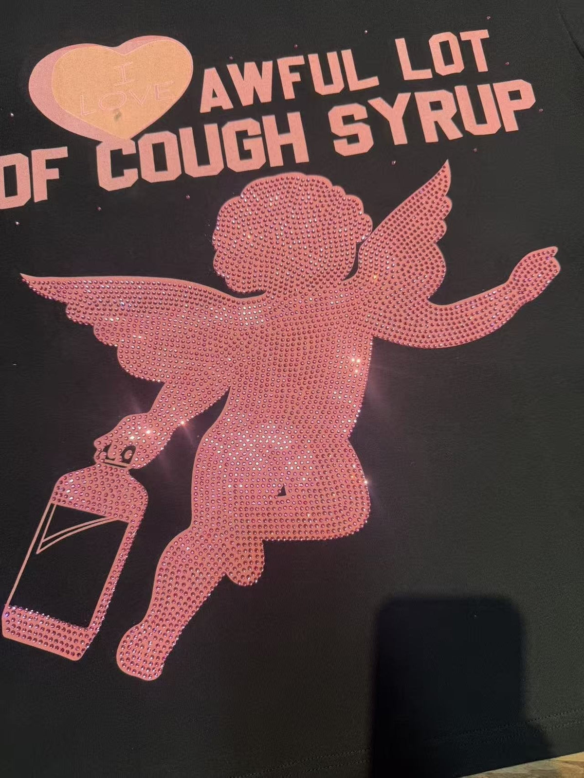 THAT'S A AWFUL LOT OF COUGH SYRUP Heart Cupid Graphic T-Shirt ¡ª fabric_closeup