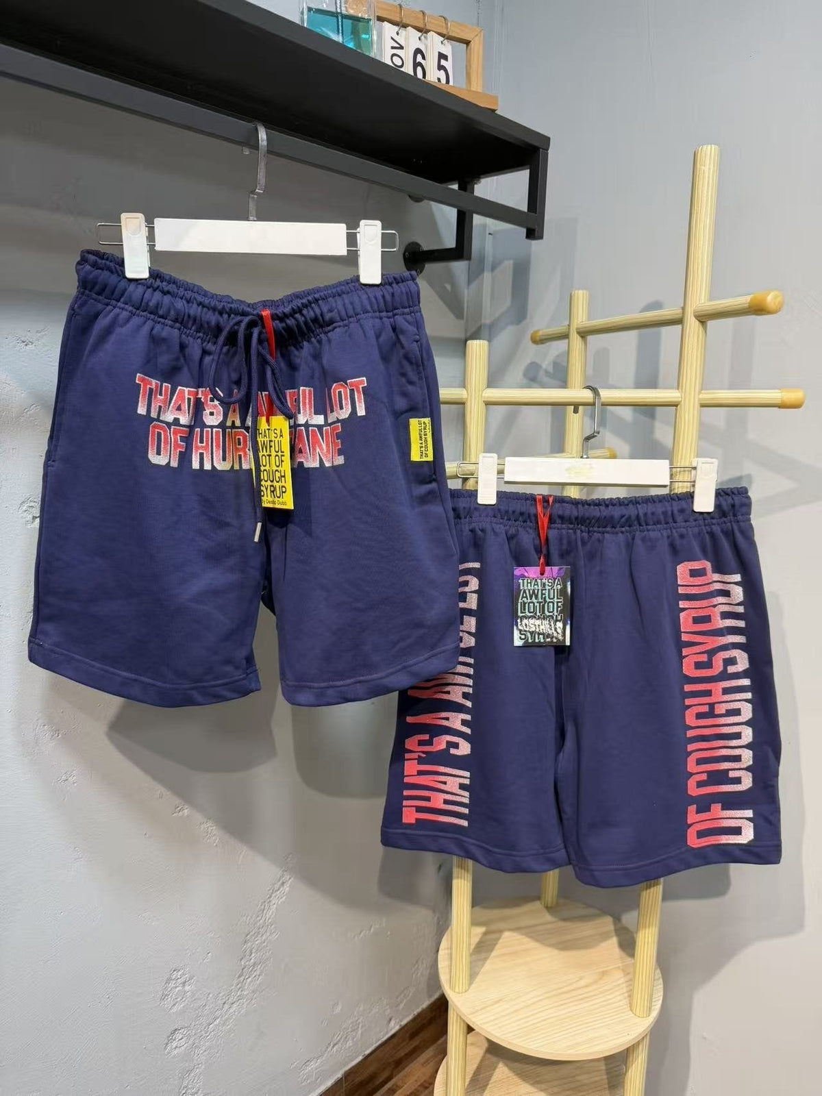 THAT'S A AWFUL LOT OF COUGH SYRUP Blue Text Graphic Shorts ¡ª front