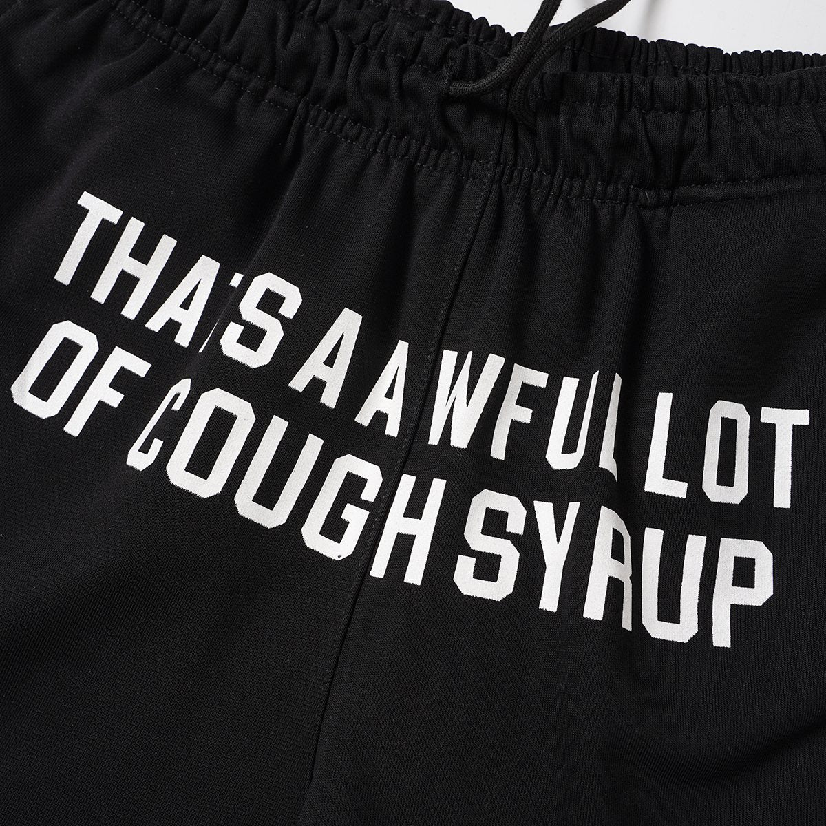 THAT'S A AWFUL LOT OF COUGH SYRUP Black Graphic Shorts ¡ª detail