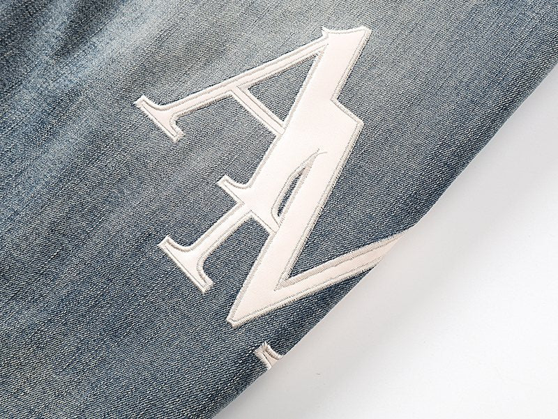 AMIRI Light Blue Distressed Appliqu¨¦ Jeans ¡ª detail