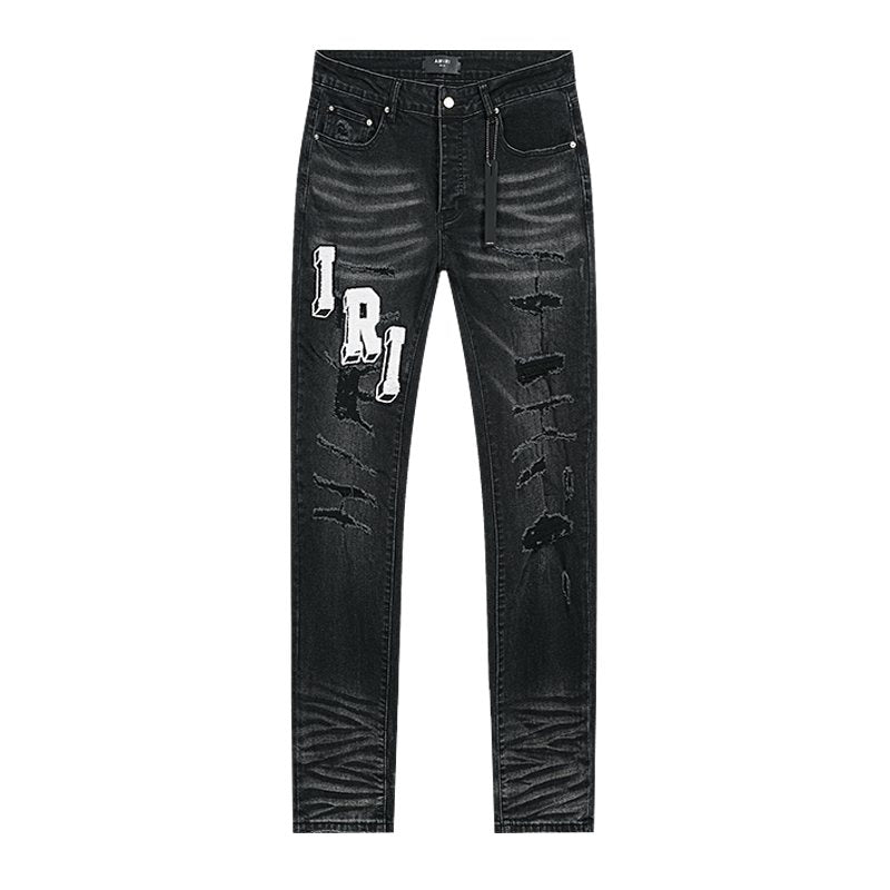 AMIRI Varsity Letter Appliqu¨¦ Distressed Jeans ¡ª front