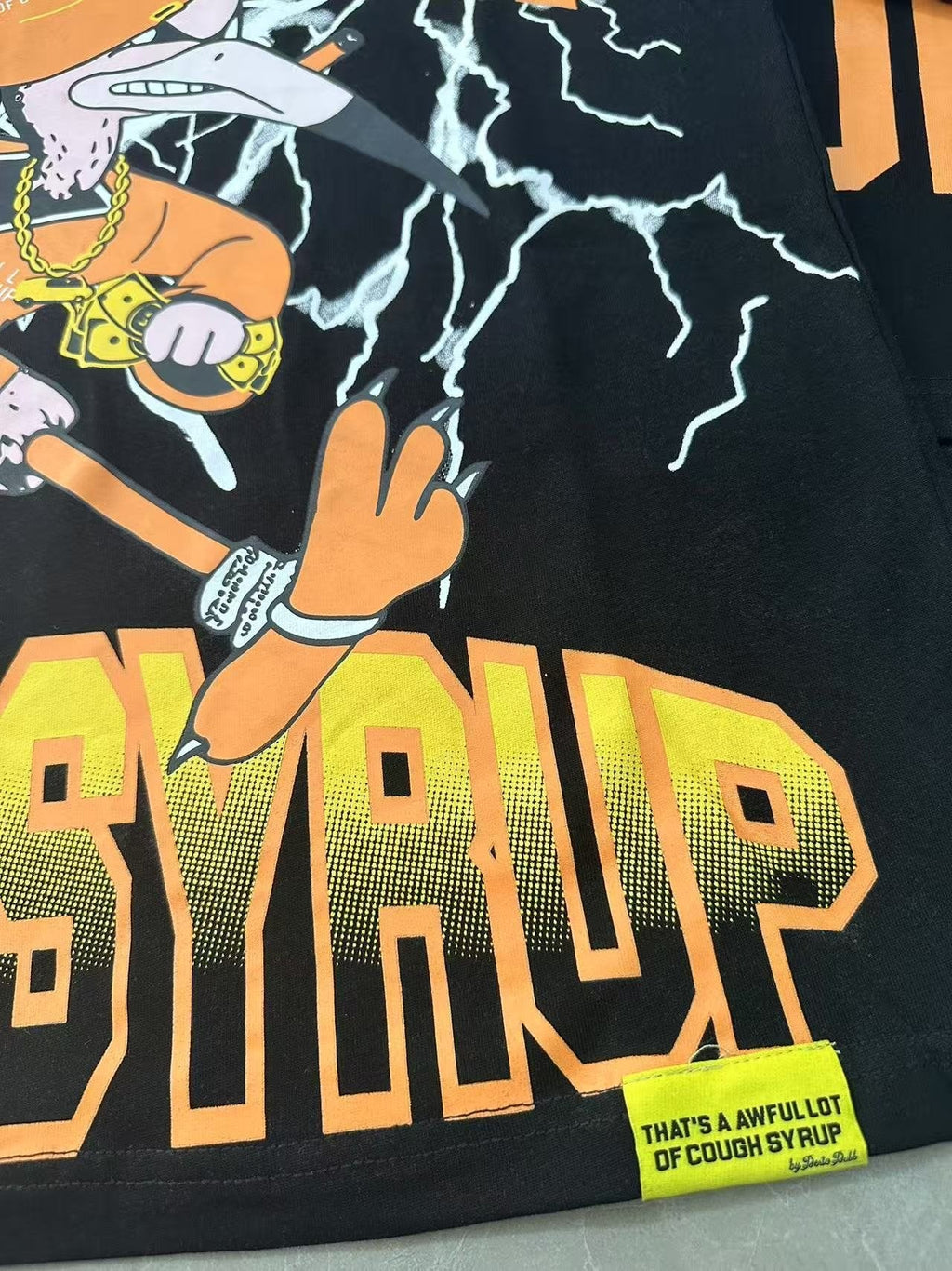 THAT'S A AWFUL LOT OF COUGH SYRUP Lightning Cartoon Graphic T-Shirt ¡ª detail