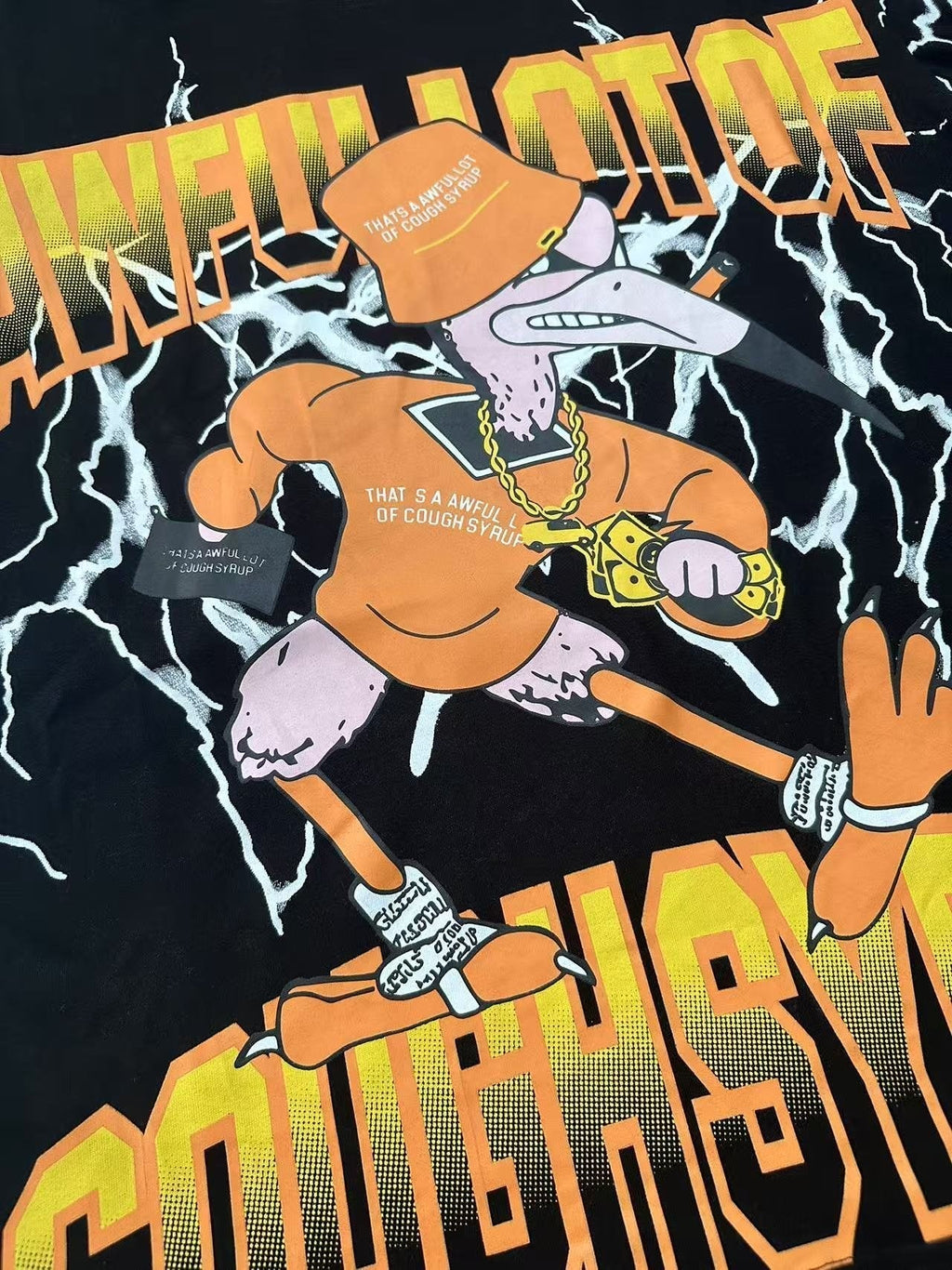 THAT'S A AWFUL LOT OF COUGH SYRUP Lightning Cartoon Graphic T-Shirt ¡ª detail